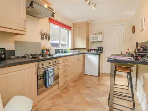 Fridge, electric kettle, cookware/dishes/utensils