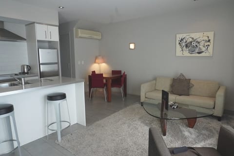 Deluxe Apartment, 1 Bedroom, Pool View | Living area | Flat-screen TV