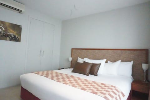 Deluxe Apartment, 1 Bedroom, Pool View | 1 bedroom, iron/ironing board, free WiFi