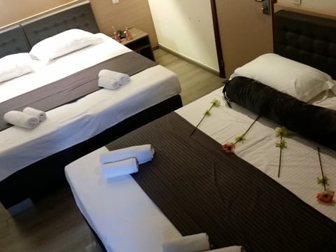 Quadruple Room | Premium bedding, in-room safe, individually furnished, desk