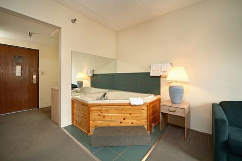 Superior Suite, 1 King Bed, Jetted Tub | Pillowtop beds, individually furnished, desk, iron/ironing board