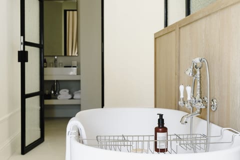 Signature Suite | Bathroom | Hair dryer, towels