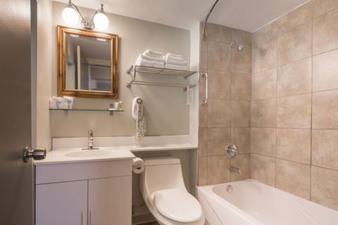 Standard Room, 1 King Bed | Bathroom | Combined shower/tub, free toiletries, hair dryer, towels