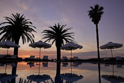 Outdoor pool, open 8:00 AM to 8:00 PM, pool umbrellas, sun loungers