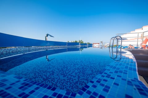 Indoor pool, 3 outdoor pools, open 9:00 AM to 7:00 PM, pool umbrellas