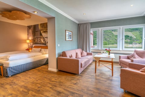 Junior Suite, River View | Living room | Flat-screen TV