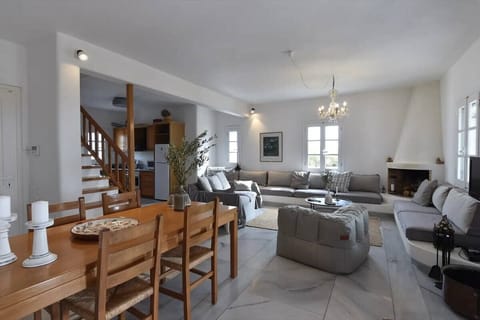 Family Apartment, Sea View, Beachfront | Living area | 40-inch TV with cable channels