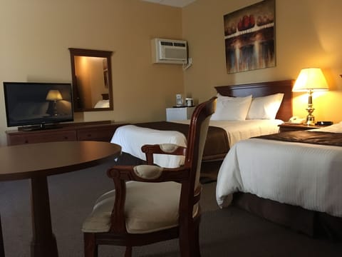 Deluxe Room, 2 Queen Beds, Jetted Tub | Desk, iron/ironing board, free WiFi, bed sheets