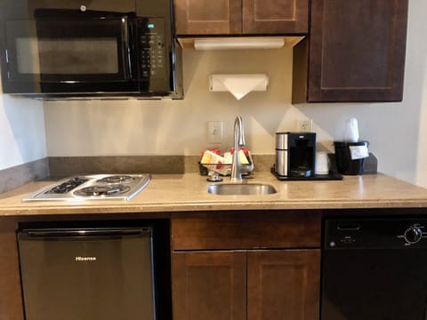 Fridge, microwave, coffee/tea maker, cookware/dishes/utensils