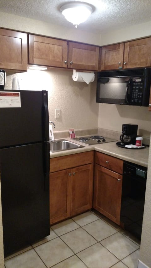 Fridge, microwave, coffee/tea maker, cookware/dishes/utensils