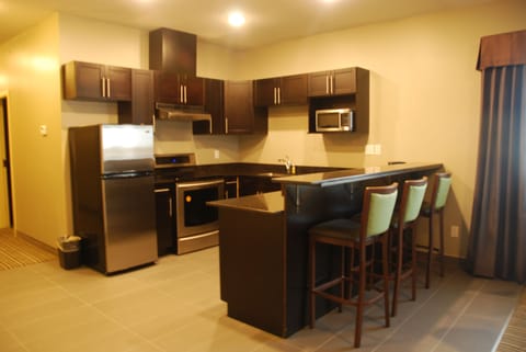 Suite, 2 Bedrooms, Non Smoking | Private kitchen | Fridge, microwave, coffee/tea maker, dining tables