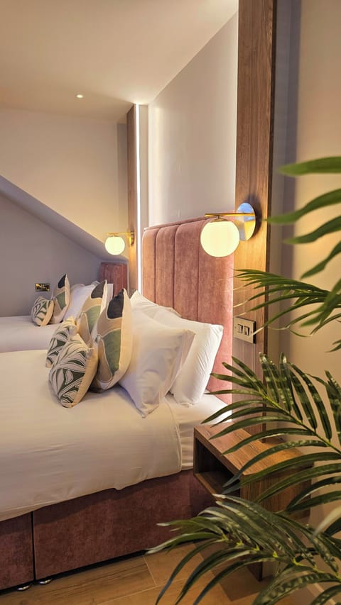 Deluxe Triple Room | Memory foam beds, iron/ironing board, travel crib, free WiFi