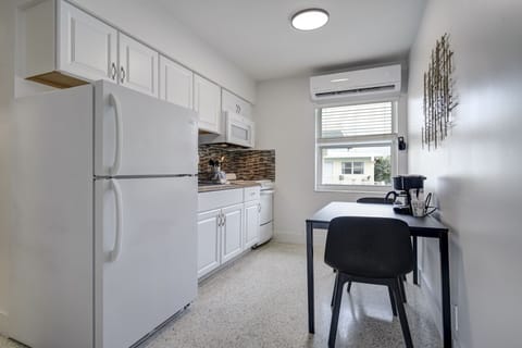 Deluxe Studio Suite, 1 King Bed, Kitchen | Private kitchen | Full-size fridge, microwave, coffee/tea maker, cleaning supplies