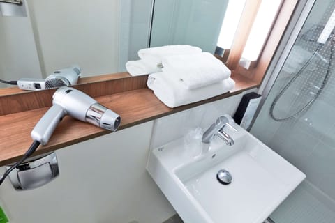 Shower, eco-friendly toiletries, hair dryer, towels