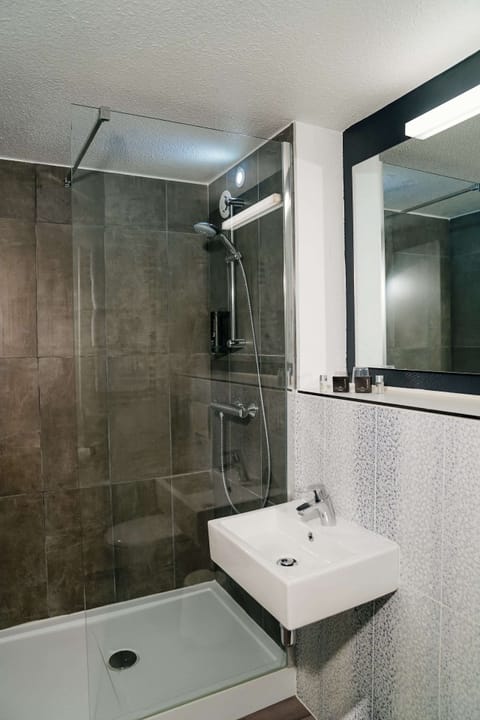 Shower, eco-friendly toiletries, hair dryer, towels