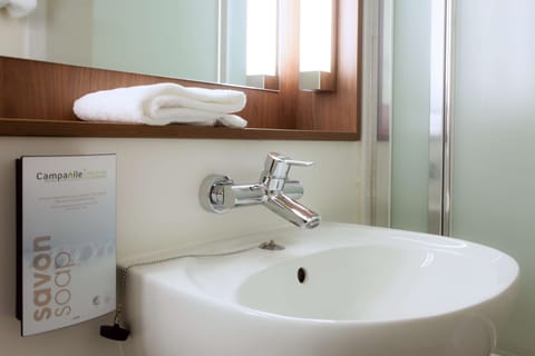 Bathtub, eco-friendly toiletries, hair dryer, towels