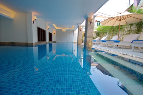 Indoor pool, open 7:00 AM to 10:00 PM, pool umbrellas, sun loungers