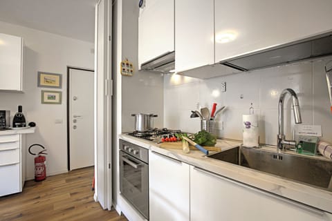 Family Apartment, 1 Bedroom (Garden & Surf Residenza By Max) | Private kitchen | Fridge, oven, stovetop, dishwasher