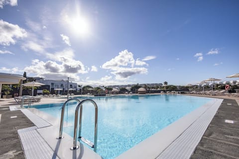 Outdoor pool, open 10:00 AM to 6:00 PM, pool umbrellas, sun loungers