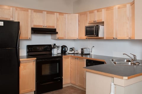 Suite, 2 Bedrooms | Private kitchen | Full-size fridge, microwave, oven, stovetop