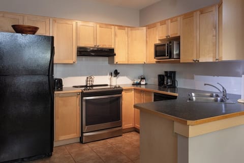 One-Bedroom Loft Suite | Private kitchen | Full-size fridge, microwave, oven, stovetop