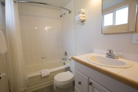 Room, 2 Queen Beds | Bathroom | Combined shower/tub, free toiletries, hair dryer, towels