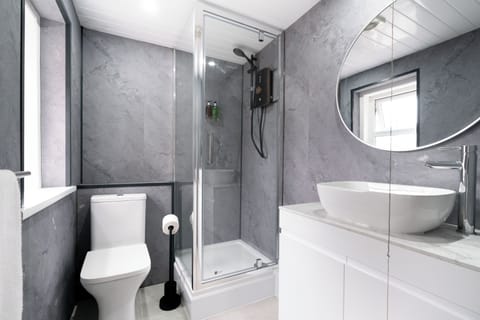 Shower, slippers, towels, soap