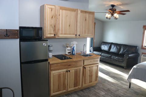 Comfort Studio, 1 King Bed, Patio, Corner | Private kitchenette | Microwave, coffee/tea maker