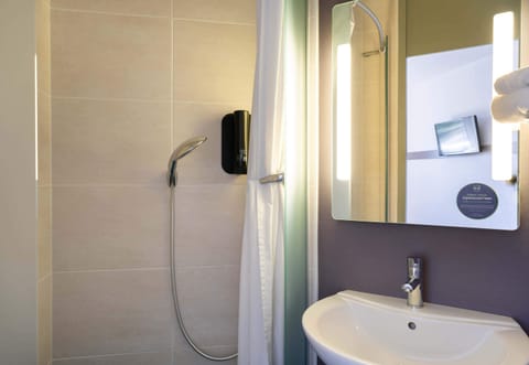 Shower, free toiletries, hair dryer, towels