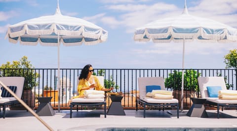 Outdoor pool, open 7:00 AM to 11:00 PM, sun loungers