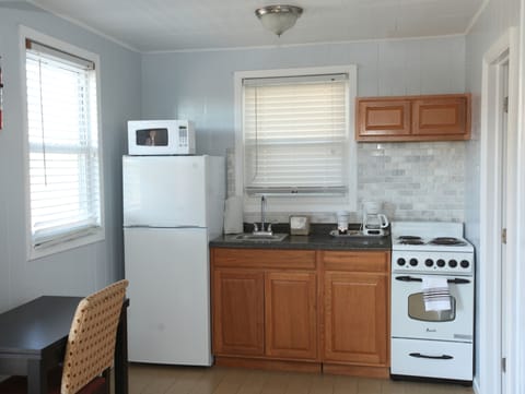 Cottage, 1 Bedroom (Living Room with Futon, Pet Friendly ) | Private kitchen | Fridge, microwave, coffee/tea maker, cleaning supplies