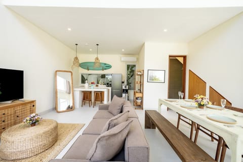 Deluxe Villa, 1 Bedroom, Patio, Pool View | Living room | 50-inch TV with cable channels