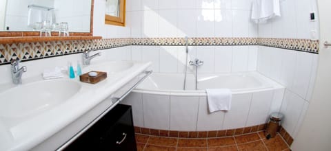 Combined shower/tub, free toiletries, hair dryer, bathrobes