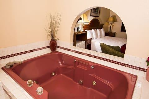 Suite, 1 Queen Bed, Jetted Tub | Desk, iron/ironing board, free WiFi, bed sheets