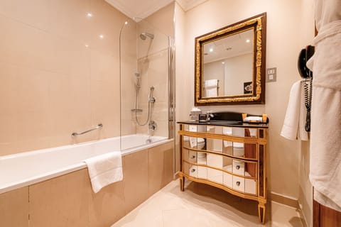 Combined shower/tub, designer toiletries, hair dryer, bathrobes