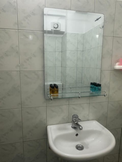 Shower, hair dryer, towels, shampoo