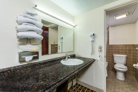 Room, 2 Double Beds | Bathroom | Combined shower/tub, hair dryer, towels