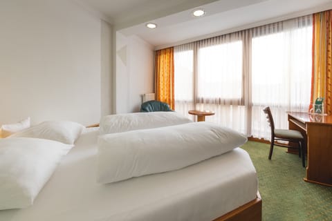 Hypo-allergenic bedding, desk, blackout drapes, soundproofing