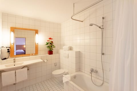 Deep soaking tub, rainfall showerhead, hair dryer, towels