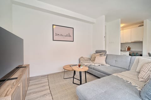 Apartment, Balcony, Hill View | Living area | 55-inch LCD TV with cable channels