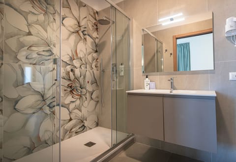 Shower, free toiletries, hair dryer, towels