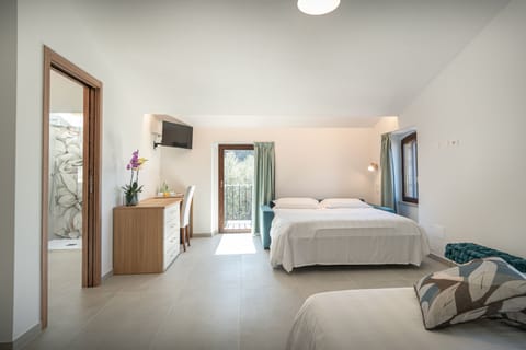 Quadruple Room, City View | Desk, laptop workspace, free WiFi