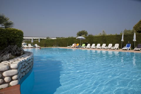 Outdoor pool, open 7:00 AM to 9:00 PM, pool umbrellas, sun loungers