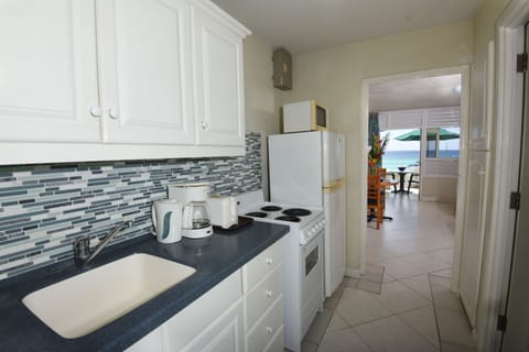 Deluxe Studio, Beachfront | Private kitchen | Fridge, microwave, oven, coffee/tea maker