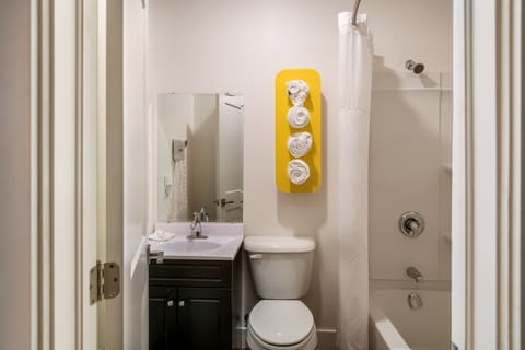 Deluxe Room, 2 Queen Beds, Non Smoking, Refrigerator | Bathroom | Shower, hair dryer, towels