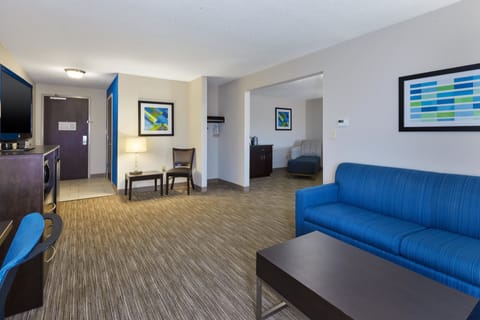 Suite, 1 King Bed | In-room safe, desk, iron/ironing board, free cribs/infant beds