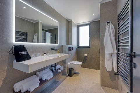 Standard Suite, Balcony, Partial Sea View | Bathroom | Shower, hair dryer, slippers, towels