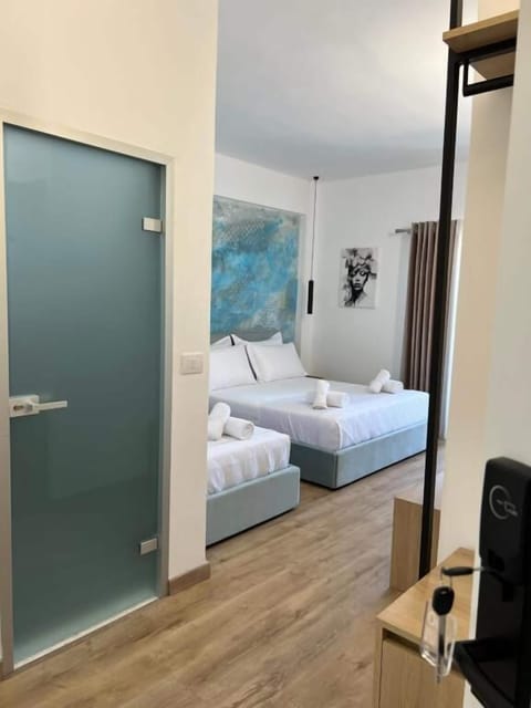 Triple Room, Balcony, Partial Sea View | Desk, free cribs/infant beds, free WiFi, bed sheets