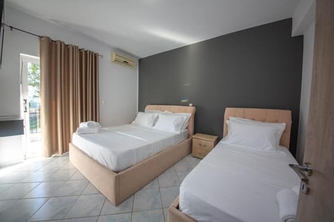 Two-Bedroom Family Room with Balcony and Sea View (4 Adults) | Free WiFi, bed sheets