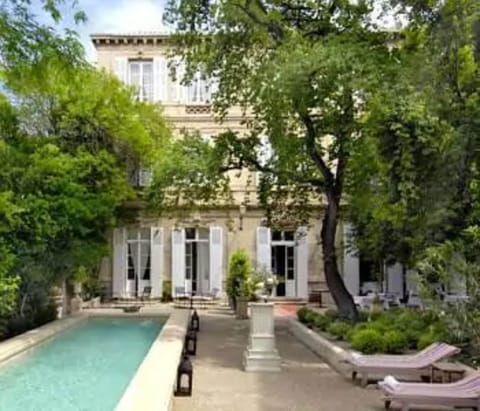 Outdoor pool, pool umbrellas, sun loungers